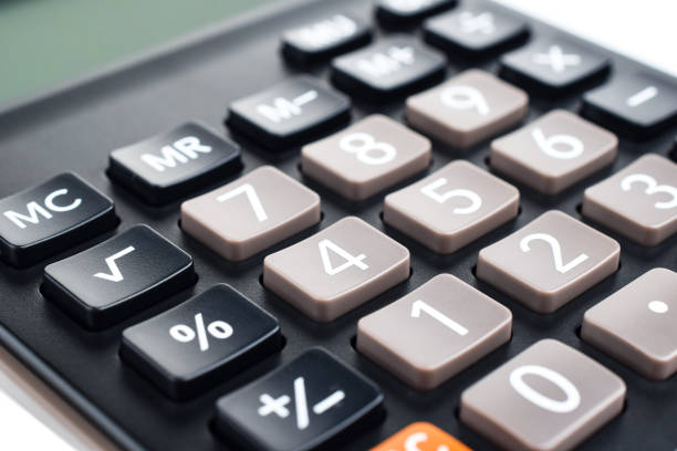 istock Black plastic digital calculator, isolated on a white background, close-up. Symbol economics, mathematics, accounting, finance concept. The day of knowledge, to calculate, to count money 1300209345