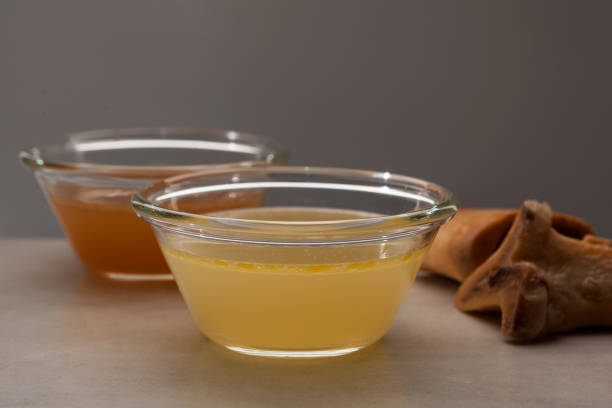 istock Two types of bone broth in glass bowls. Close-up, selective focus. Beef bones are source of natural collagen, which is useful for joints and provides the body with essential amino acids 1300209676