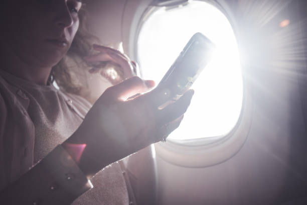 istock Serious woman holding mobile, close up. 1300210467