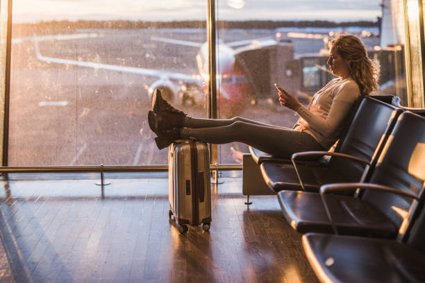 istock Young female passenger waiting for flight. 1300210488