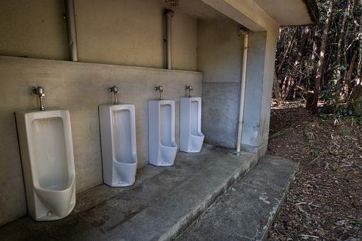 Photo of dirty men's public toilet