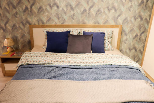 istock bedroom interior with a large bed and beautiful pillows 1300212843
