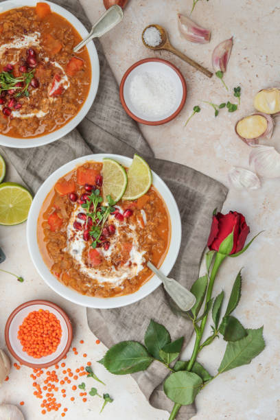 istock Romantic Curry with Lentils and Red Roses for Valentines Date 1300213131