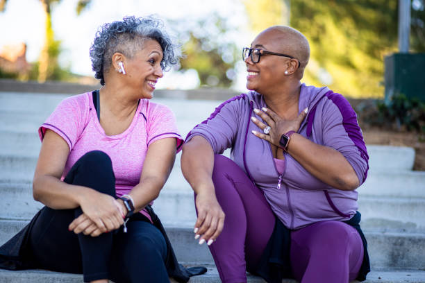 Two black woman relaxing after workout Two mature black woman together in nature. womens issues stock pictures, royalty-free photos & images