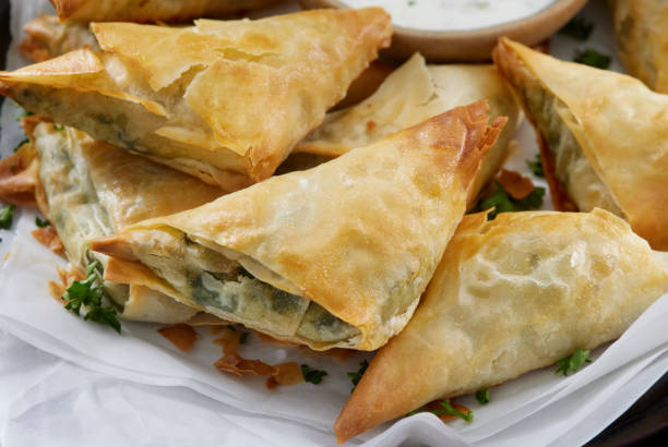 Spanakopita with Tzatziki Sauce Spanakopita with Tzatziki Sauce spanakopita stock pictures, royalty-free photos & images