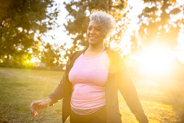 istock Black woman walking in the sunset 1300215950