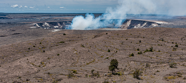 Halemaumau crater is a pit crater located within the much larger summit caldera of Klauea in Hawaii Volcanoes National Park. Halemaumau is home to Pele, Goddess of Hawaiian Volcanoes, according to the traditions of Hawaiian mythology. According to the Hawaii Volcano Observatory the crater is currently active, with lava in an open vent fluctuating from 70 to 150 meters below the crater floor.