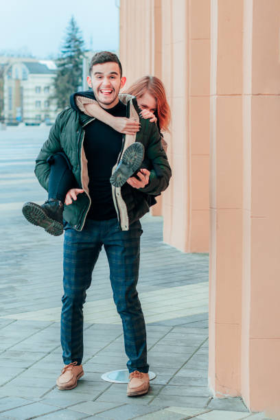 istock Cheerful Couple Having Fun on the Street 1300219603