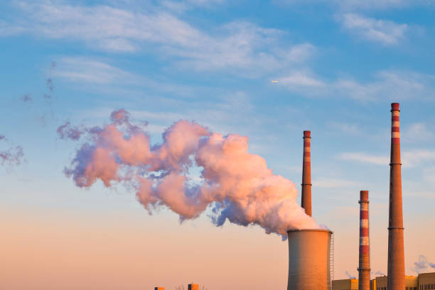 istock Industrial chimney in winter 1300222410