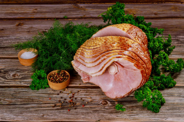 istock Delicious holiday meal, sliced pork ham. 1300224758