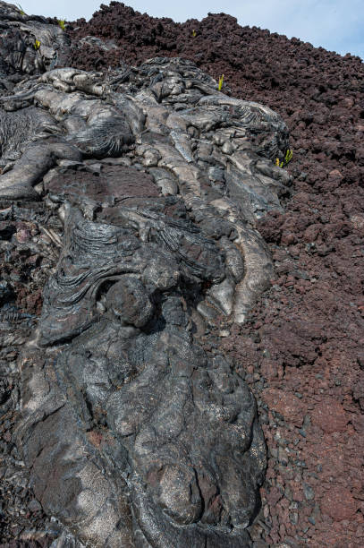 istock Pahoehoe, is basaltic lava that has a smooth, billowy, undulating, or ropy surface. Aa lava has arough surface and is broken into pieces. Hawaii Volcanoes National Park, Hawaii, The Big Island. 1300225694