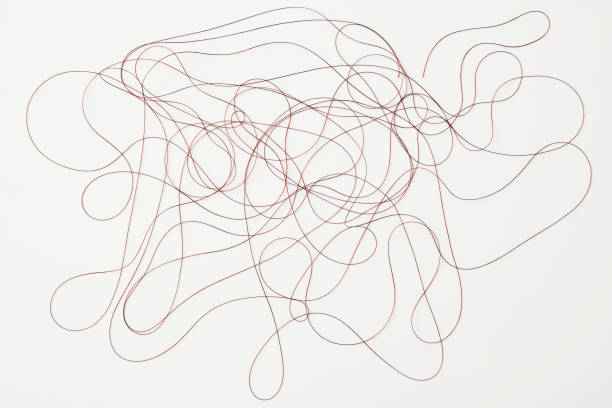 istock Isolated shot of crowded brown thread on white background 1300225800