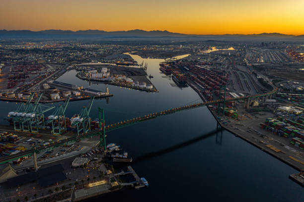 Vincent Thomas Bridge at Sunrise with waterfront. Photo taken on January 18,2021 ash the Los Angeles California port on terminal island. san pedro los angeles photos stock pictures, royalty-free photos & images