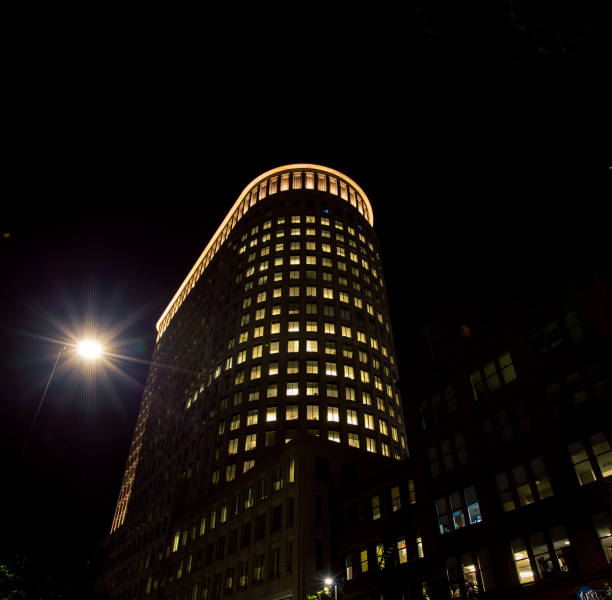 istock office building at night in Boston 1300230808