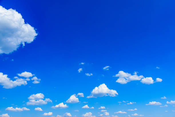 istock White fluffy clouds in the blue sky 1300231398