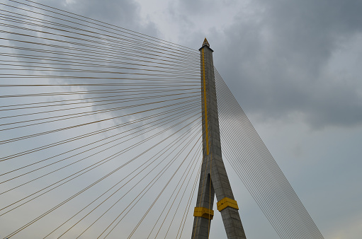 Pylon and cables of the Rama VIII Bridge in Bangkok, Thailand, seen from below.