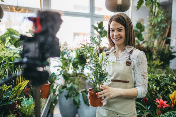 istock A modern woman recording an online tutorial on how to keep flowers in a pot 1300234078