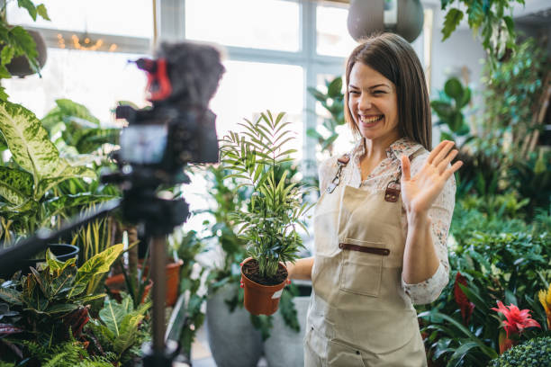 istock A modern woman recording an online tutorial on how to keep flowers in a pot 1300234101