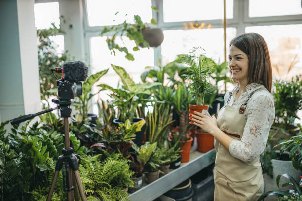 istock A modern woman recording an online tutorial on how to keep flowers in a pot 1300234116