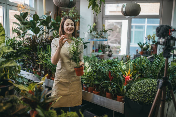 istock A modern woman recording an online tutorial on how to keep flowers in a pot 1300234120