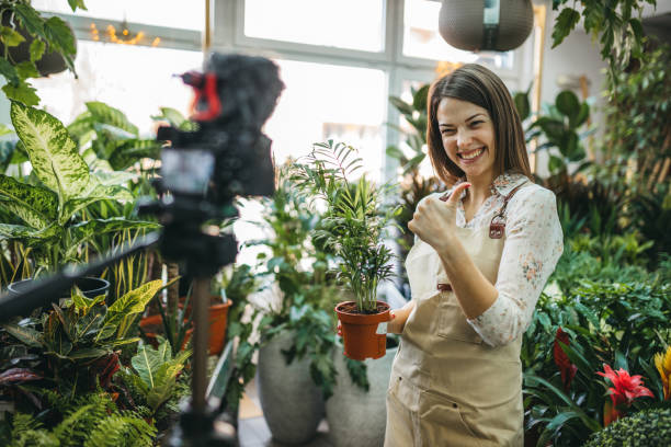 istock A modern woman recording an online tutorial on how to keep flowers in a pot 1300234127