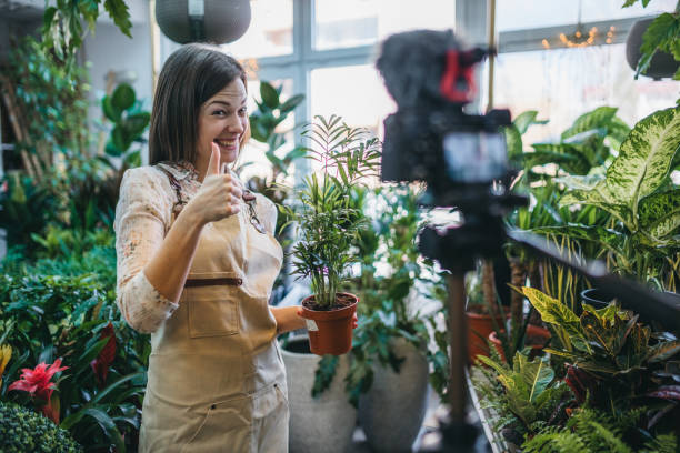 istock A modern woman recording an online tutorial on how to keep flowers in a pot 1300234129