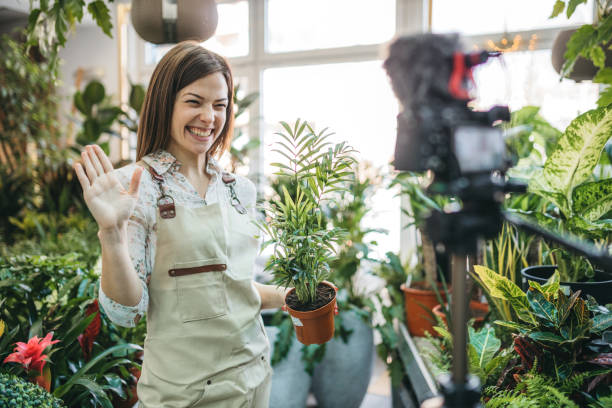 istock A modern woman recording an online tutorial on how to keep flowers in a pot 1300234158