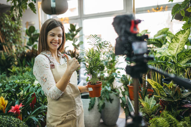 istock A modern woman recording an online tutorial on how to keep flowers in a pot 1300234159