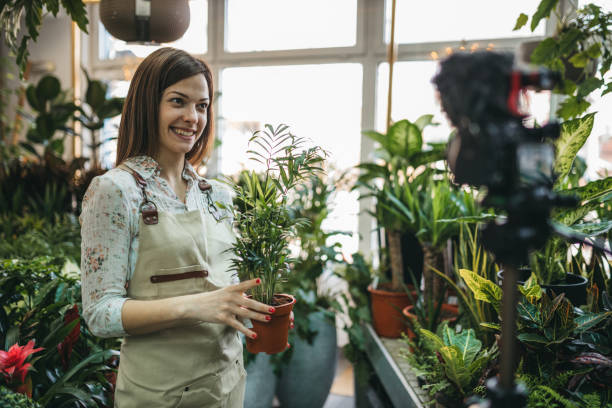 istock A modern woman recording an online tutorial on how to keep flowers in a pot 1300234178