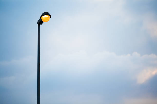 istock Street lamp on evening blue sky and clouds background and copy space 1300234330