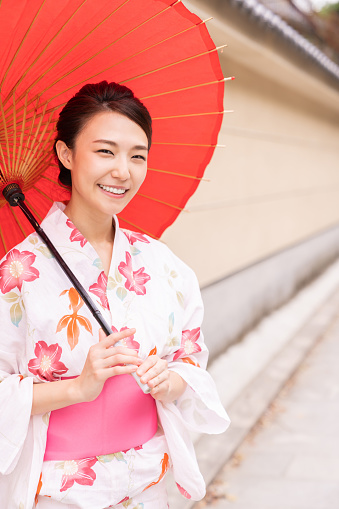 attractive asian woman wearing traditional Japanese casual summer kimono called \