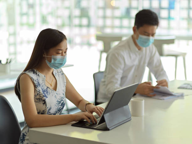 istock Businesspeople working on their task while sitting next to each other in meeting room 1300237781