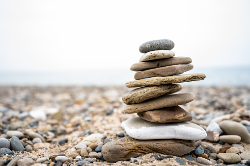 Rocks in sand pile isolated on white background and texture