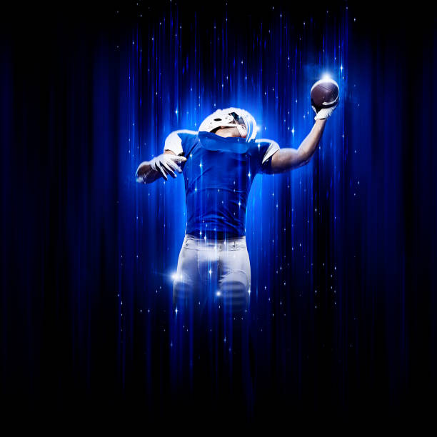 held fußballer trägt eine blaue uniform - football helmet american football yellow american football uniform stock-fotos und bilder