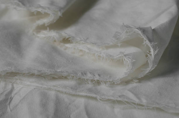 istock Texture of Crumpled White Calico Fabric. 1300246804
