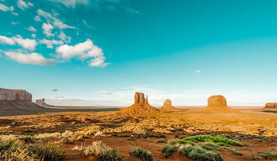Sandstone mountains in the red sand desert of Monument Valley on the Arizona-Utah border, United States.