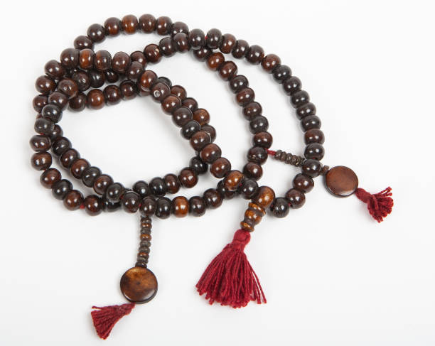 Rosary beads on white background stock photo