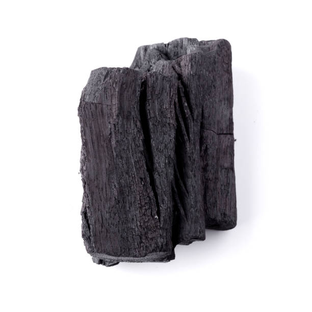 istock Natural wood charcoal Isolated on white background 1300254335