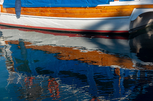 Reflection of wooden yacht in Bodrum harbour