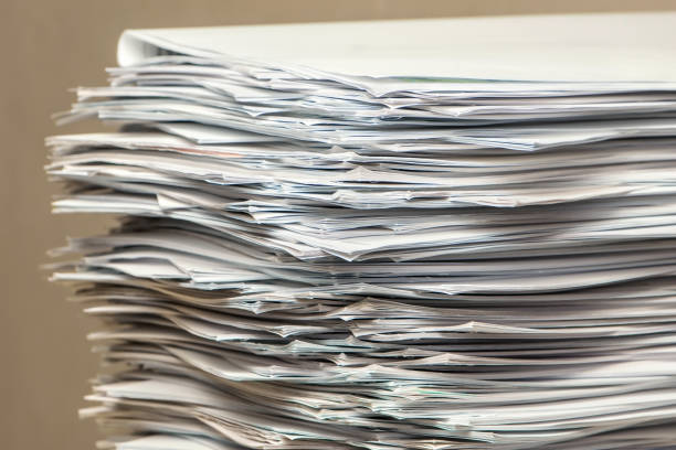 istock pile of paper documents in the office 1300254545