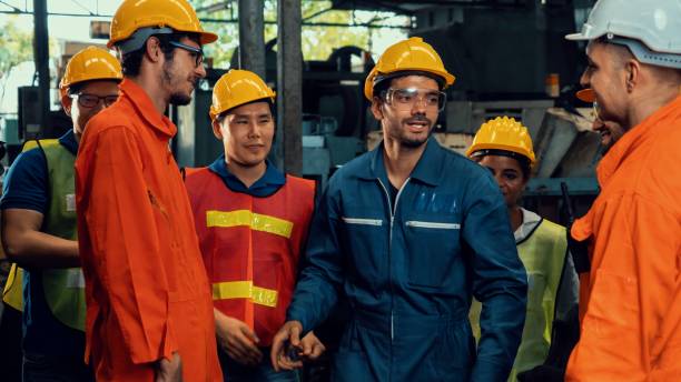 istock Skillful worker attending brief meeting in the factory . 1300255399