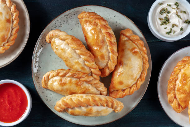 istock Empanadas, shot from above with various sauces 1300255668