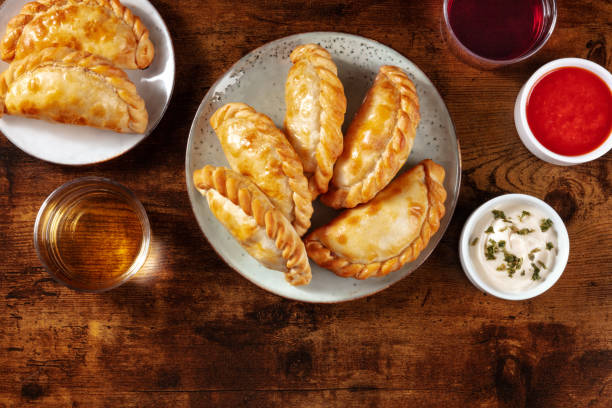 istock Empanadas with wine and sauces, overhead flat lay shot with copy space 1300255684