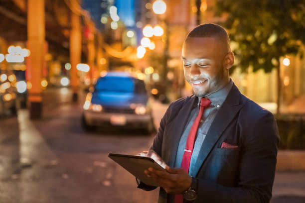 istock Businessman reading messages on 5G Digital Tablet Computer in Chicago 1300255721
