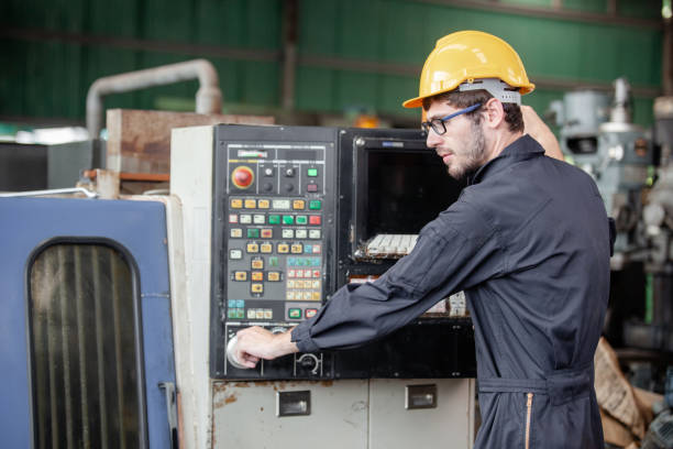 istock workers at an industrial plant. working together manufacturing activities.. worker and engineer under inspection and checking production process on factory 1300256345