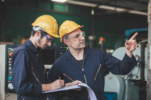 istock workers talking and laughing at a factory. workers at an industrial plant 1300256556