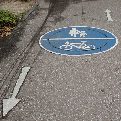 Both pedestrians and bicycles may use this road in both directions.  Bi-directional foot and bicycle lane.