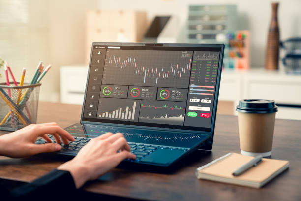 istock Stock exchange market concept, business people trader looking computer with graphs analysis candle line on table in office, diagrams on screen. 1300257425