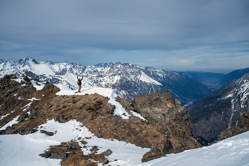 Happy men on top of the mountain