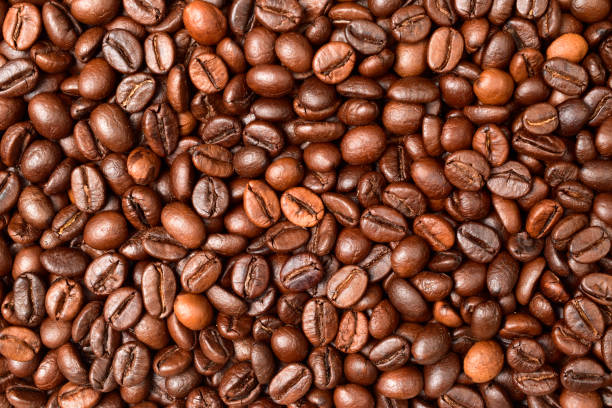 istock Coffee beans texture background, top view of roasted roasted coffee beans pattern 1300262222